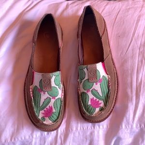 Women’s Ariat cruiser slip-ons. Brown leather wish flowering cactus design.